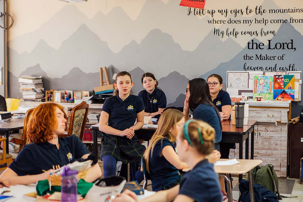 A group of middle schoolers having a discussion in a classroom