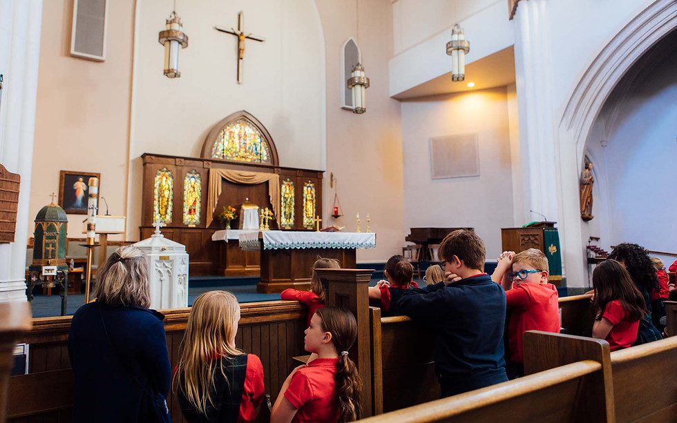 Students at Blessed Sacrament Catholic Church kneeling