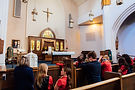Children kneeling at Blessed Sacrament Church in Denver, Co